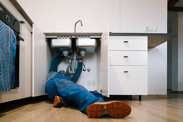Professional Drain Cleaning technician working in Plainville, MA